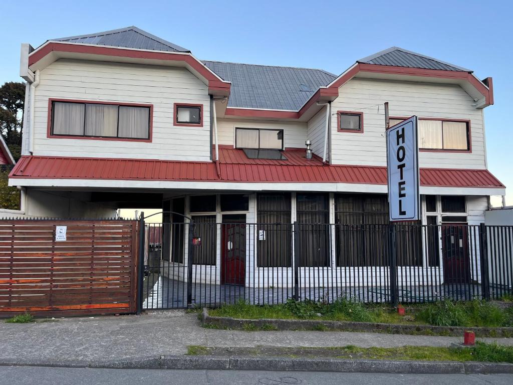a house with a sign in front of it at Altos de Miramar in Puerto Montt