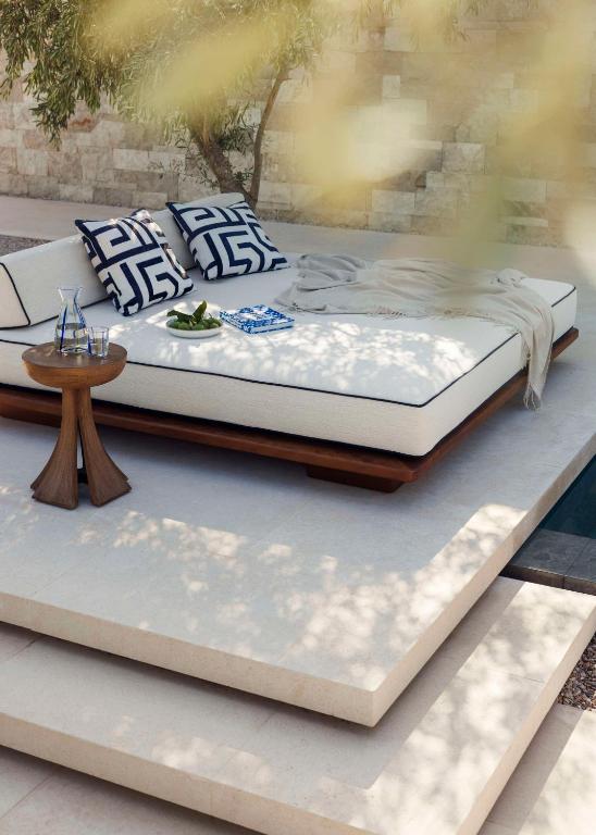 a bed sitting on top of a table at One&Only Aesthesis, Athens in Athens