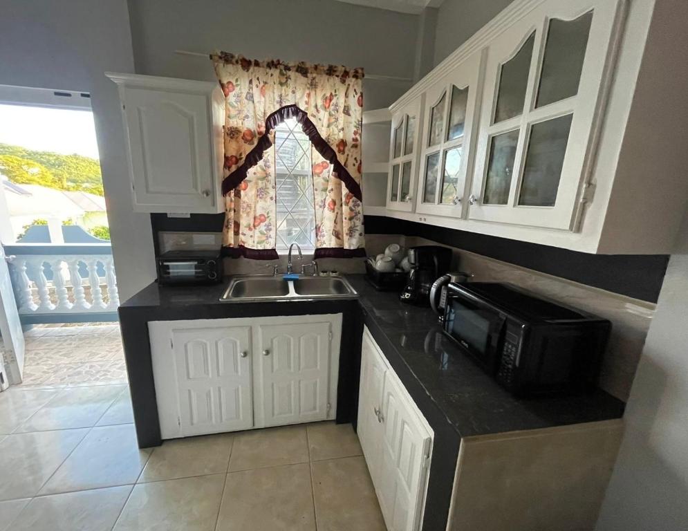 Kuchyň nebo kuchyňský kout v ubytování Apartment in Corinth