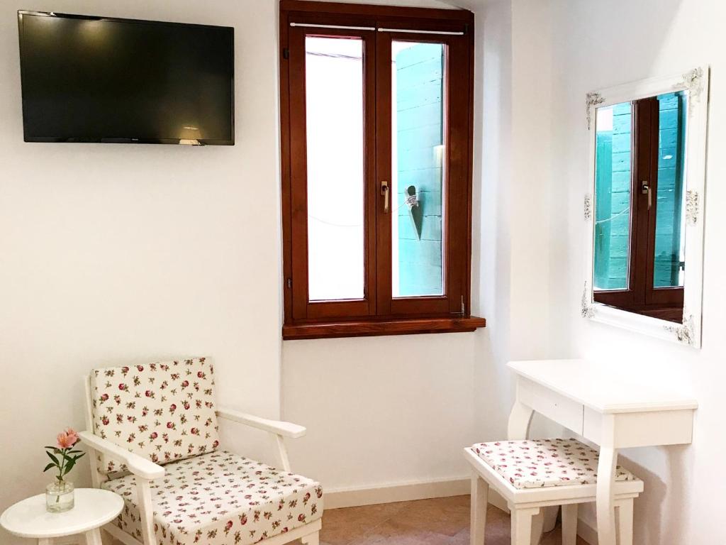 TV a/nebo společenská místnost v ubytování Guesthouse Casa Vittoria