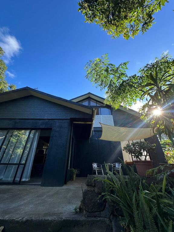 a house with a solar panel on the front of it at Casa Takarua in Hanga Roa