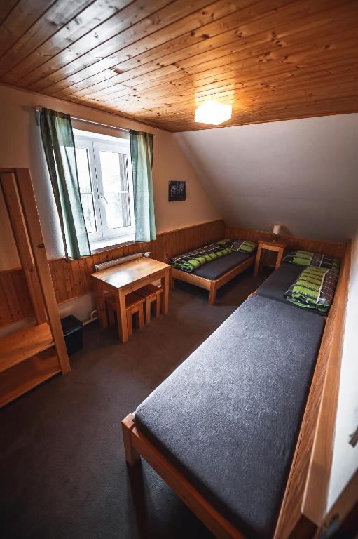 Postel nebo postele na pokoji v ubytování Chata Skalka