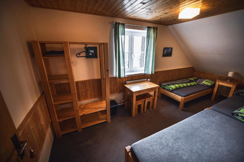 Postel nebo postele na pokoji v ubytování Chata Skalka