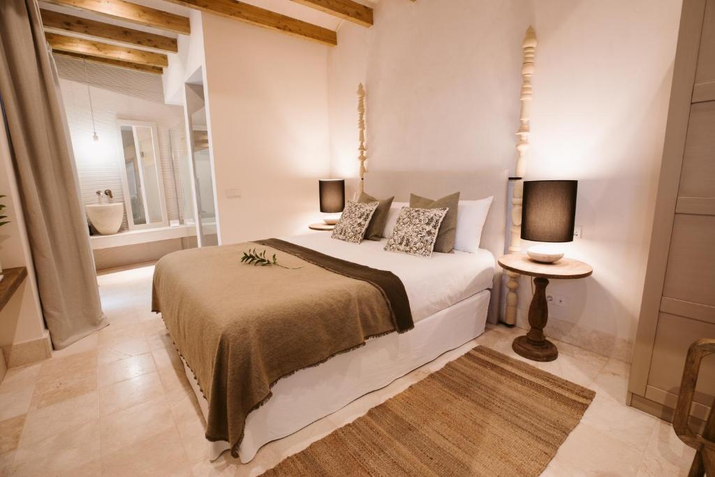 Postel nebo postele na pokoji v ubytování Casa Aura Hotel