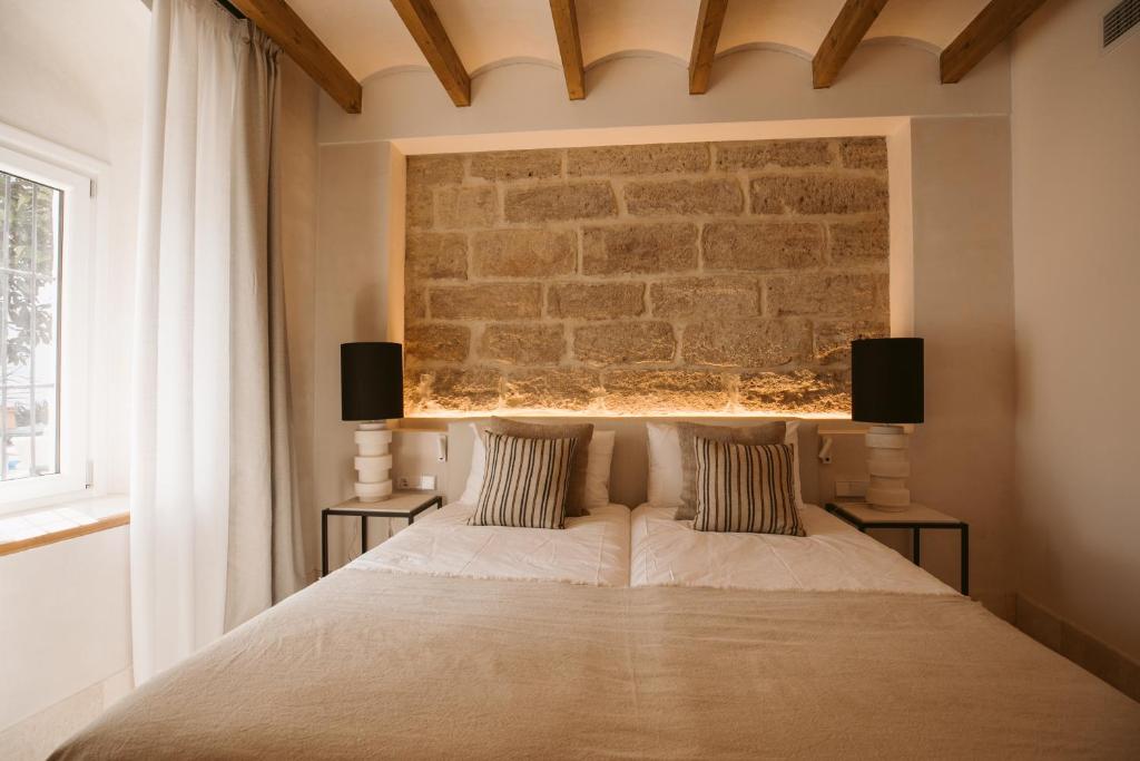 Postel nebo postele na pokoji v ubytování Casa Aura Hotel