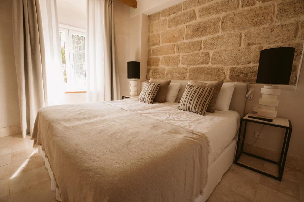 Postel nebo postele na pokoji v ubytování Casa Aura Hotel