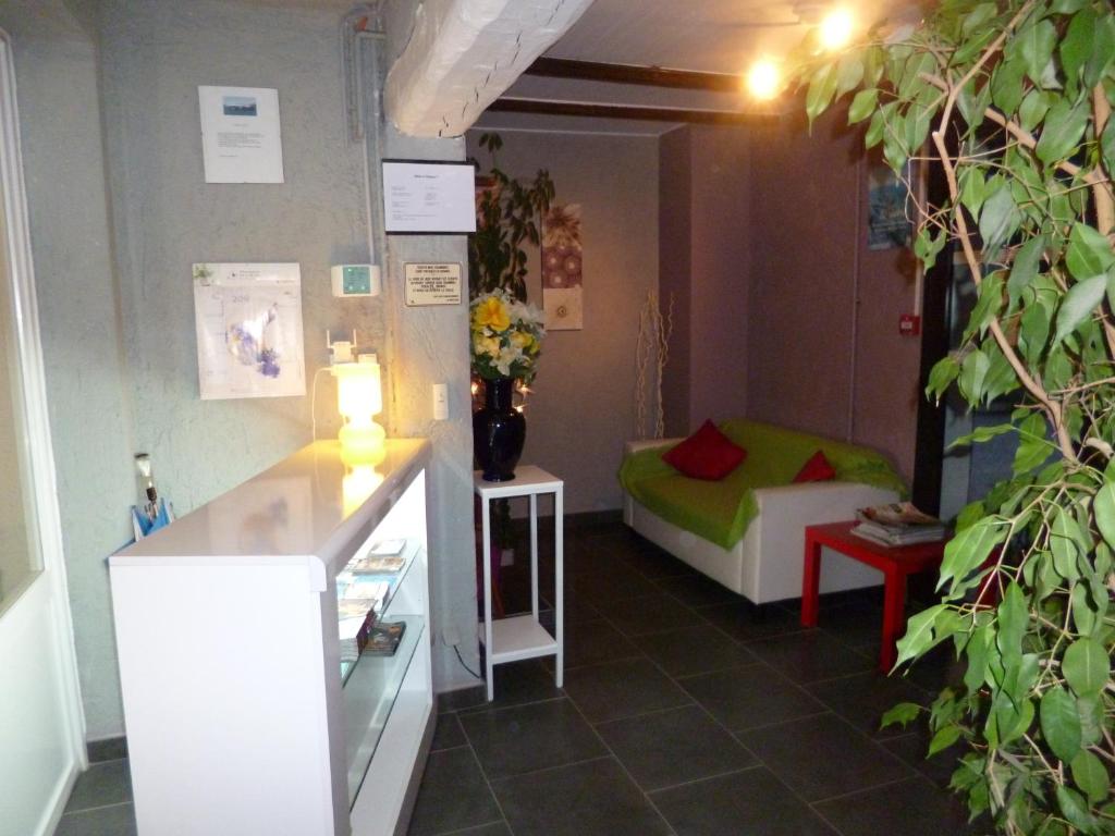 Postel nebo postele na pokoji v ubytování Hôtel le Calypso