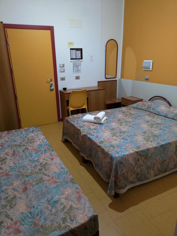 Postel nebo postele na pokoji v ubytování Meublé Nautic Rooms b&b