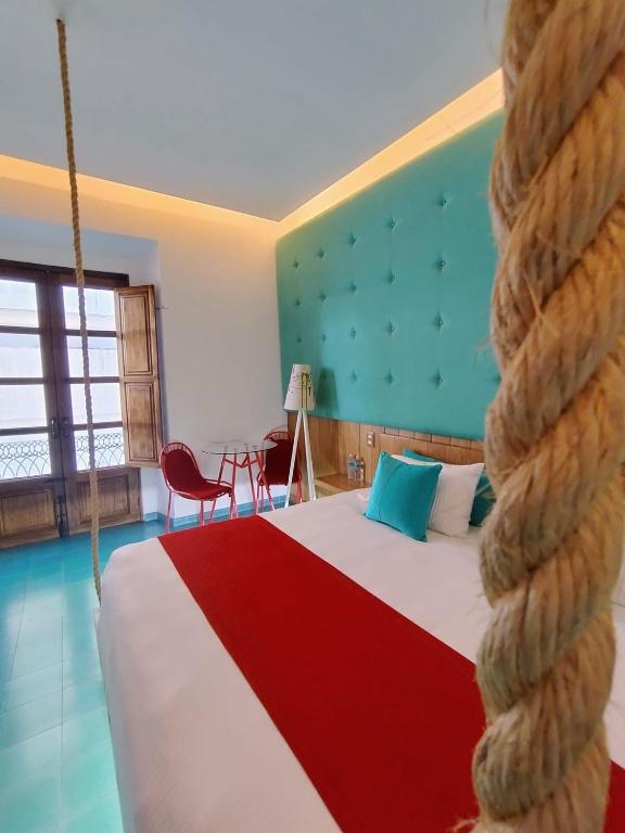 Postel nebo postele na pokoji v ubytování Del Carmen Concept Hotel Boutique by Chai