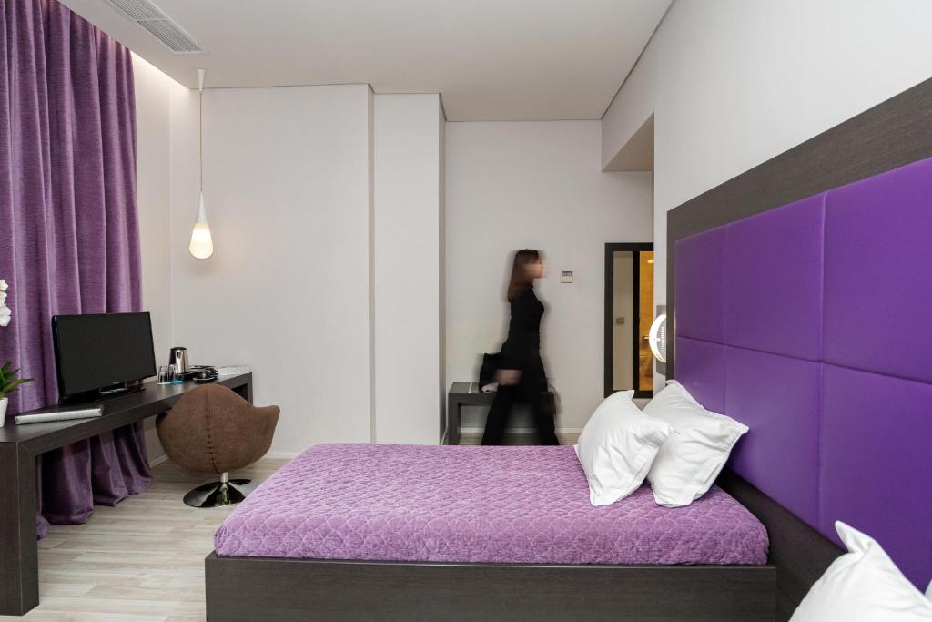 Postel nebo postele na pokoji v ubytování Sky Hotel Tirana