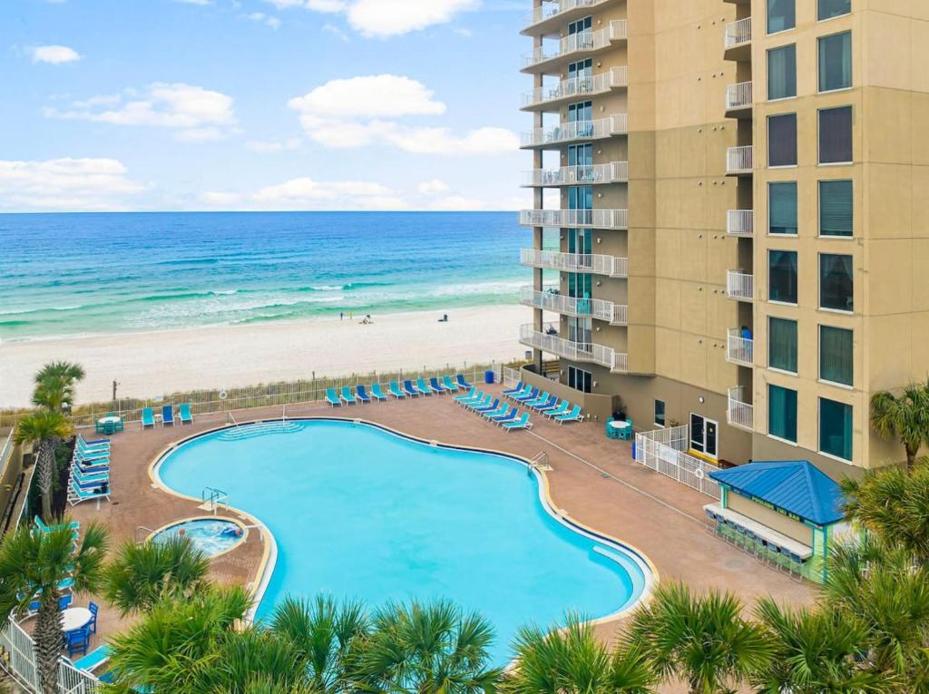 an aerial view of a resort with a swimming pool and the beach at 20th-floor condo with Gulf views, resort amenities & 2 lagoon-style pools in Panama City Beach