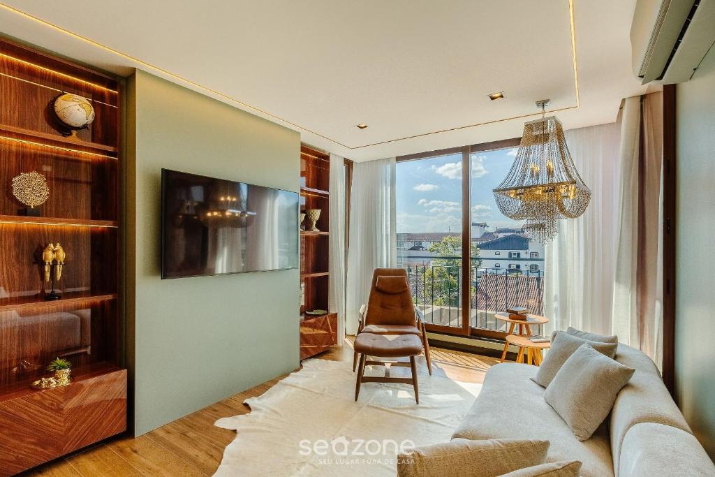 Μια τηλεόραση ή/και κέντρο ψυχαγωγίας στο Lindos Apartamentos em Gramado - DMS