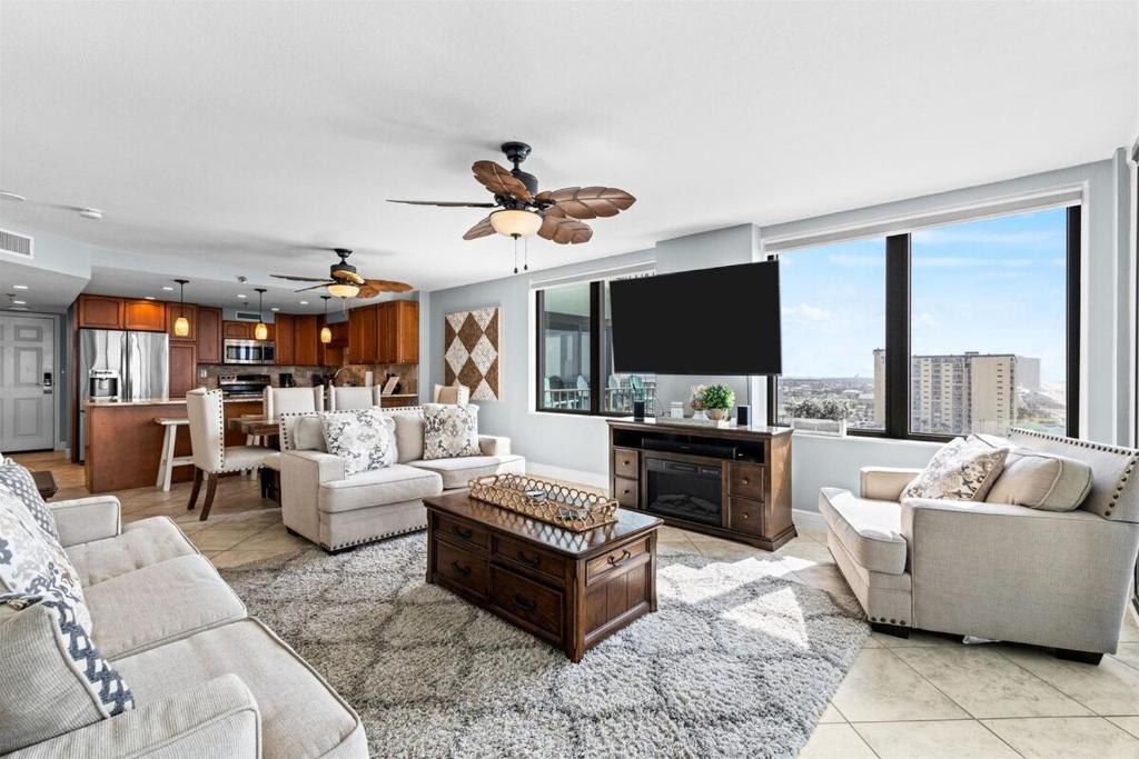 a living room with a couch and a tv at Gulf Peak Retreat - Watercrest 2 BR 2 BA - Sleeps in Panama City Beach