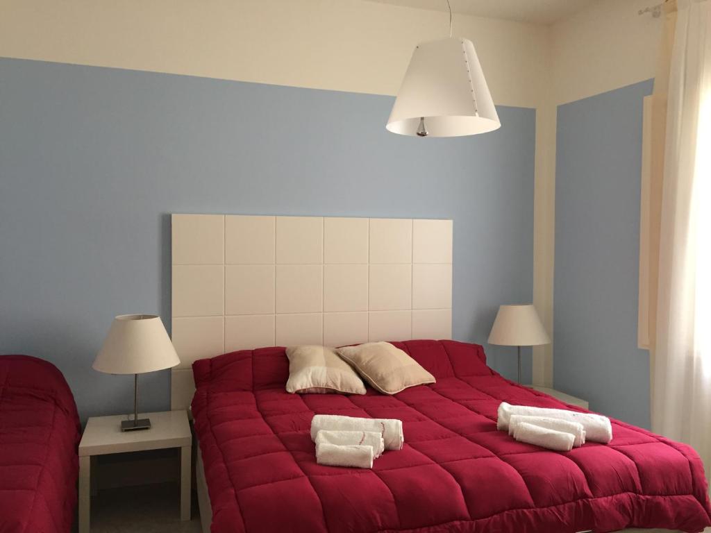 Posteľ alebo postele v izbe v ubytovaní AlbaChiara Suite Rooms - City Center
