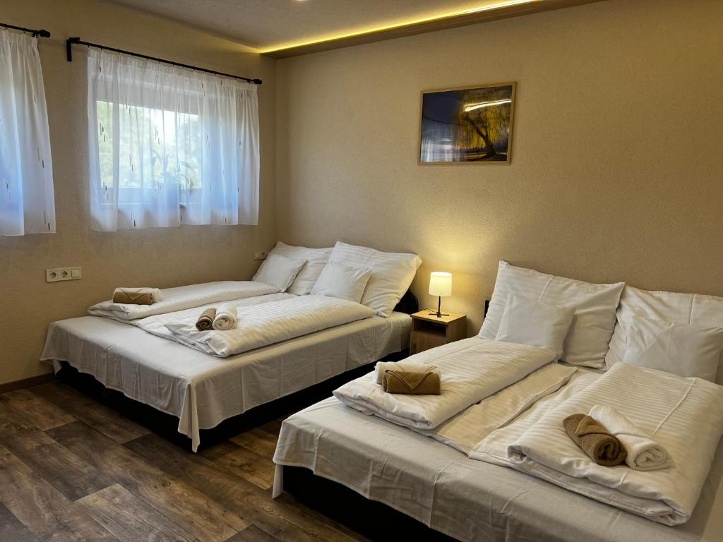 Postel nebo postele na pokoji v ubytování Seregély Vendégház