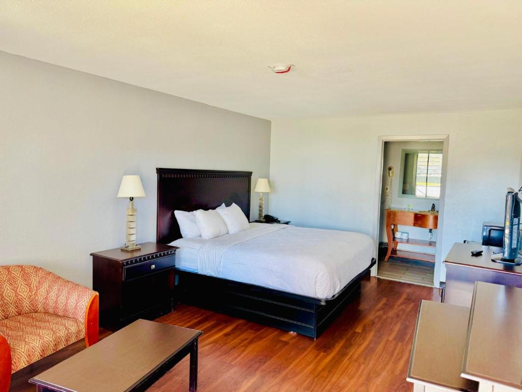Postel nebo postele na pokoji v ubytování Vip inn and suites