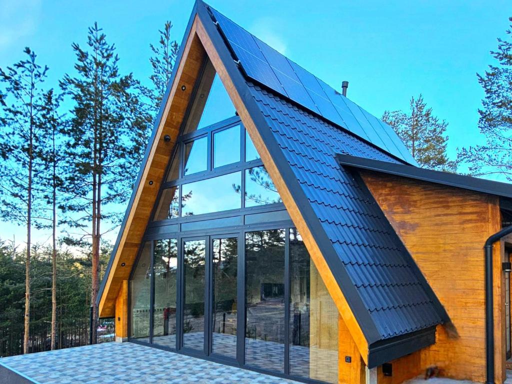 an image of a house with a metal roof at Planinska kuća Homey in Zlatibor