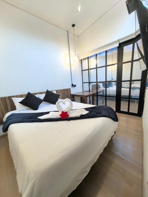 Postel nebo postele na pokoji v ubytování Hotel Quinta Bolivar