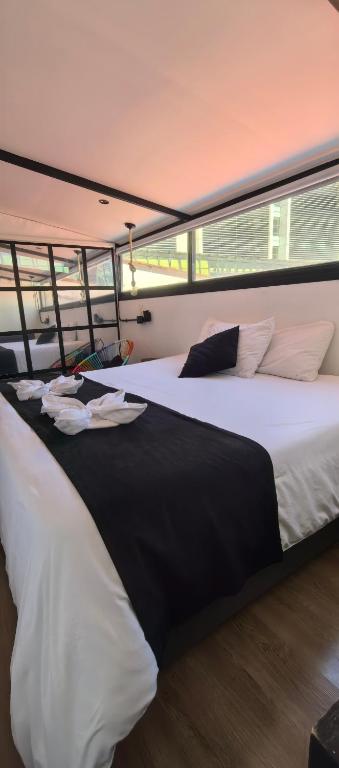 Postel nebo postele na pokoji v ubytování Hotel Quinta Bolivar