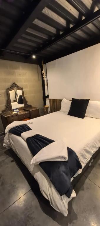 Postel nebo postele na pokoji v ubytování Hotel Quinta Bolivar