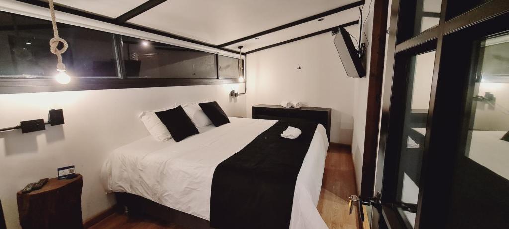 Postel nebo postele na pokoji v ubytování Hotel Quinta Bolivar