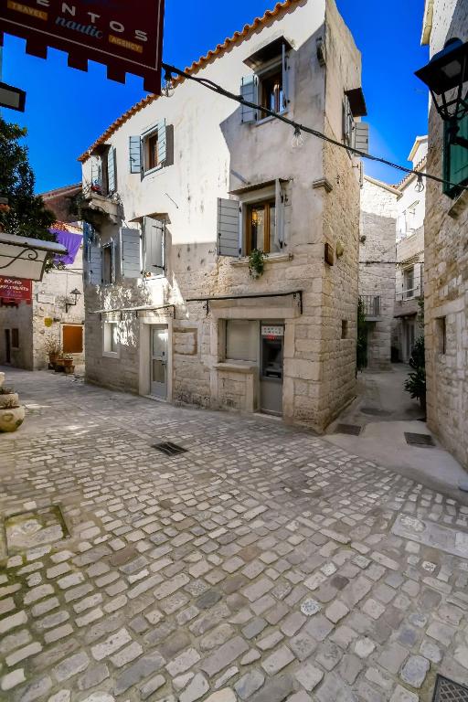 an empty street in front of a building at House Morski brk in Trogir