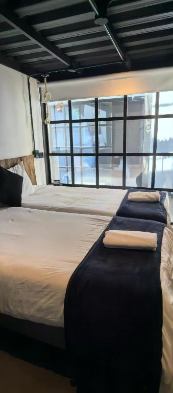 Postel nebo postele na pokoji v ubytování Hotel Quinta Bolivar