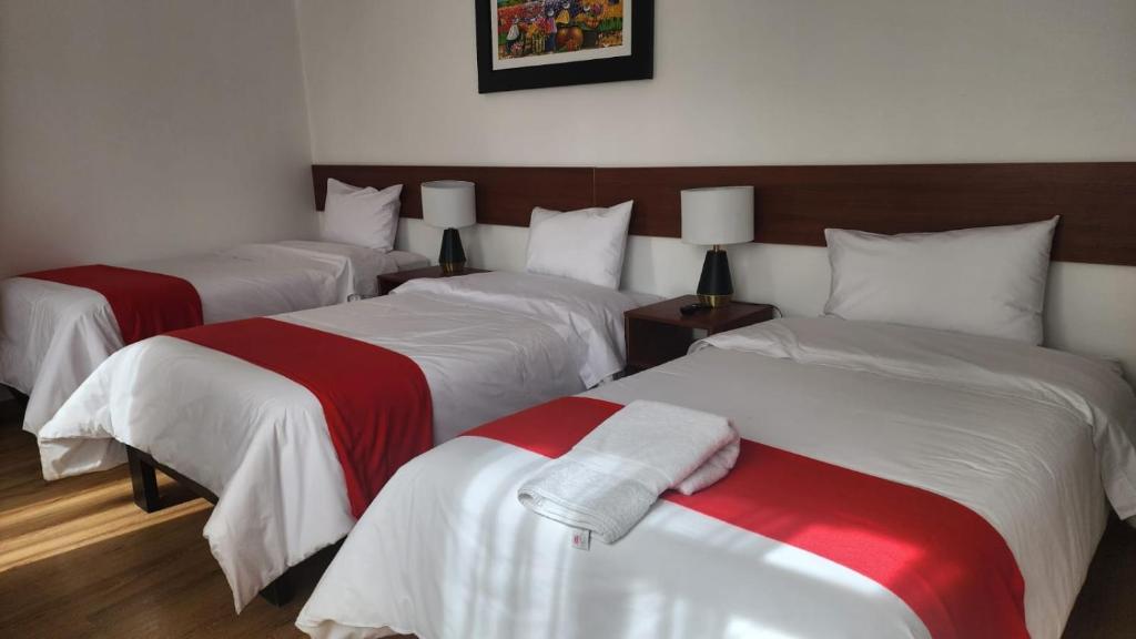 Letto o letti in una camera di INCA PALACE EXPERIENCE Hotel