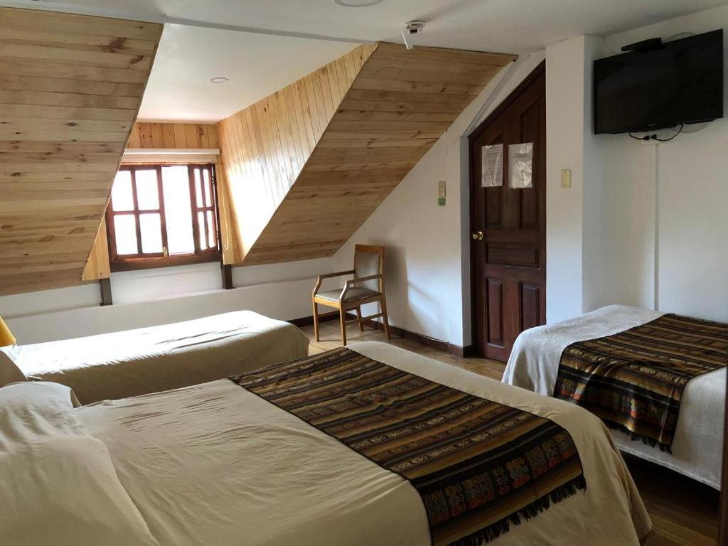 Postel nebo postele na pokoji v ubytování Casa del Arupo