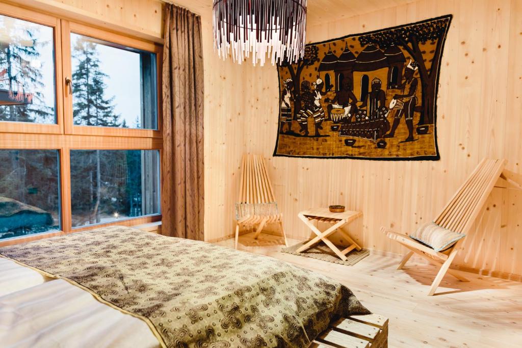 Ένα ή περισσότερα κρεβάτια σε δωμάτιο στο Forest Chalet Resort FELIZITAS