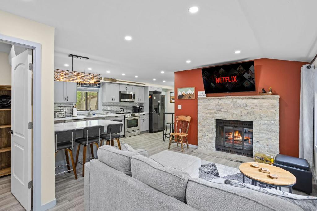 a living room with a couch and a fireplace at The Cozy Cubhouse Perfect Couples Getaway in Thornhurst