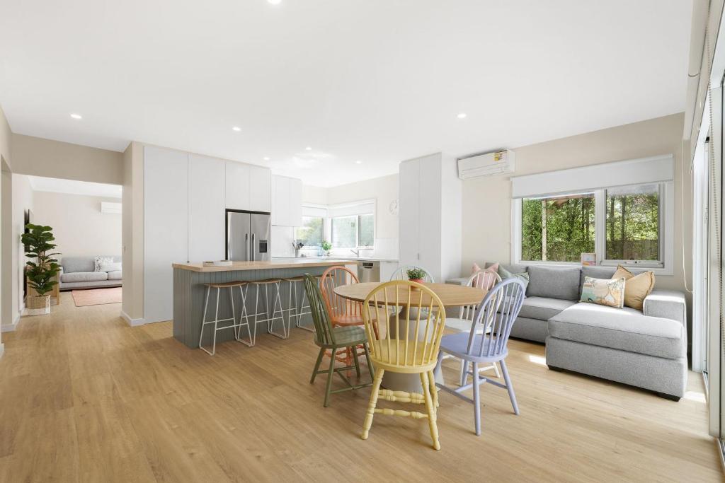 a kitchen and living room with a table and chairs at Aberdeen in Cowes