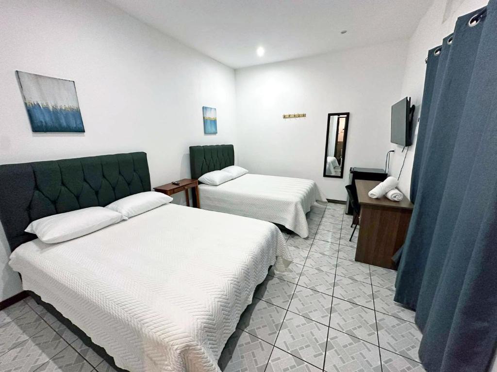 Postel nebo postele na pokoji v ubytování Surf Ranch Tamarindo