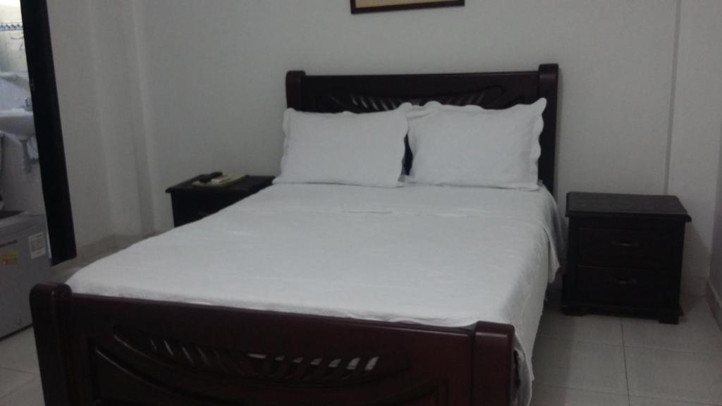 Postel nebo postele na pokoji v ubytování Hotel La Vieja Sara