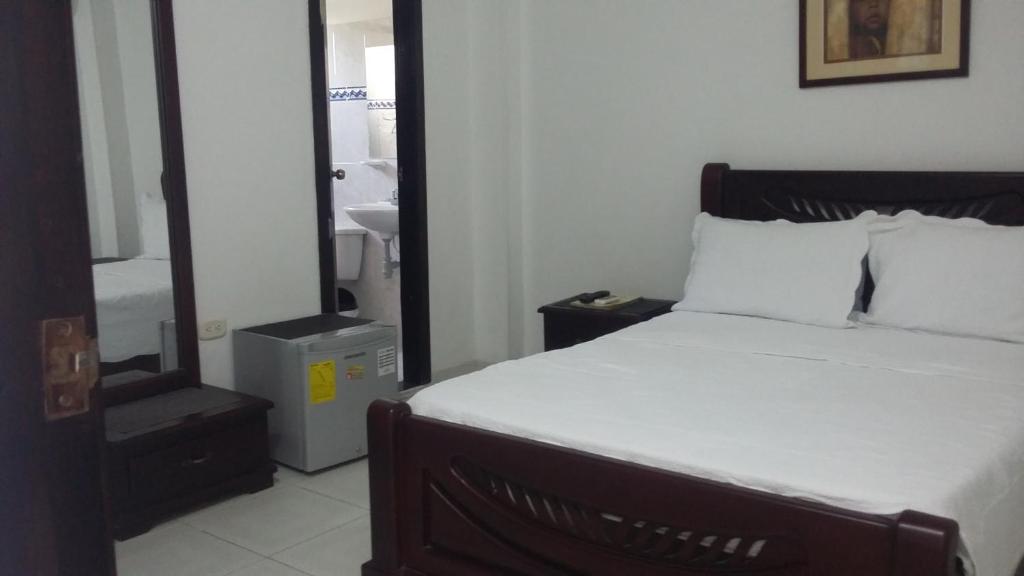 Postel nebo postele na pokoji v ubytování Hotel La Vieja Sara