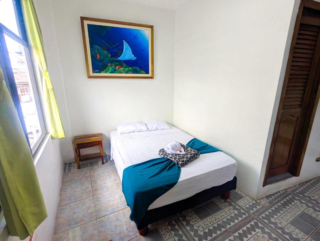 Postel nebo postele na pokoji v ubytování Hostal Gardner