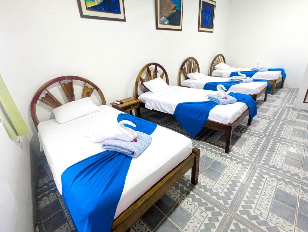 Postel nebo postele na pokoji v ubytování Hostal Gardner