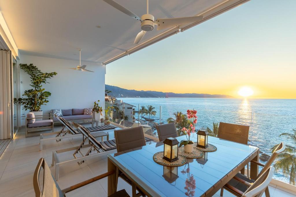 a dining room with a view of the ocean at Puerto Vallarta Resort Condo, On-Site Beach Access in Puerto Vallarta