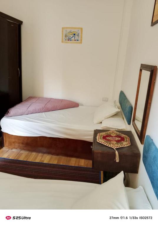 Postel nebo postele na pokoji v ubytování G Hostel inn pyramids