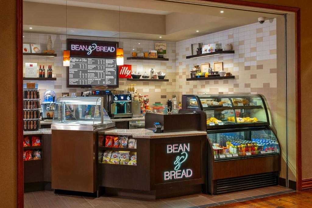 a grocery store with a cash register and a counter with food at The Westin Houston Downtown in Houston