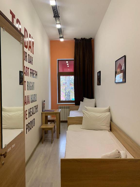 Postel nebo postele na pokoji v ubytování Central Hostel