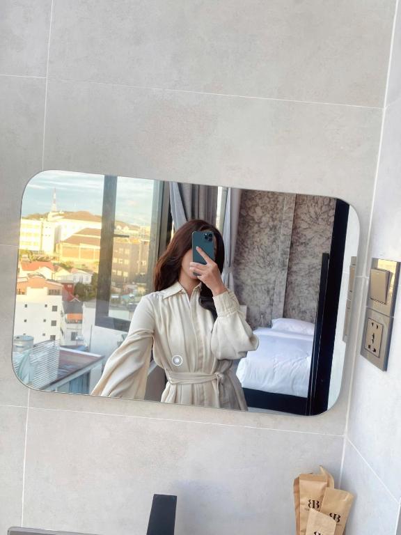 Postel nebo postele na pokoji v ubytování Ben Ben Hotel