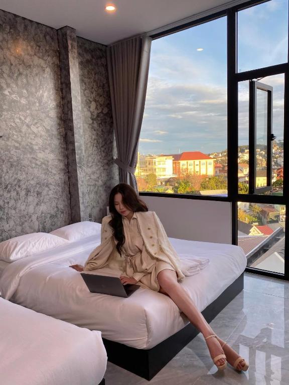 Postel nebo postele na pokoji v ubytování Ben Ben Hotel