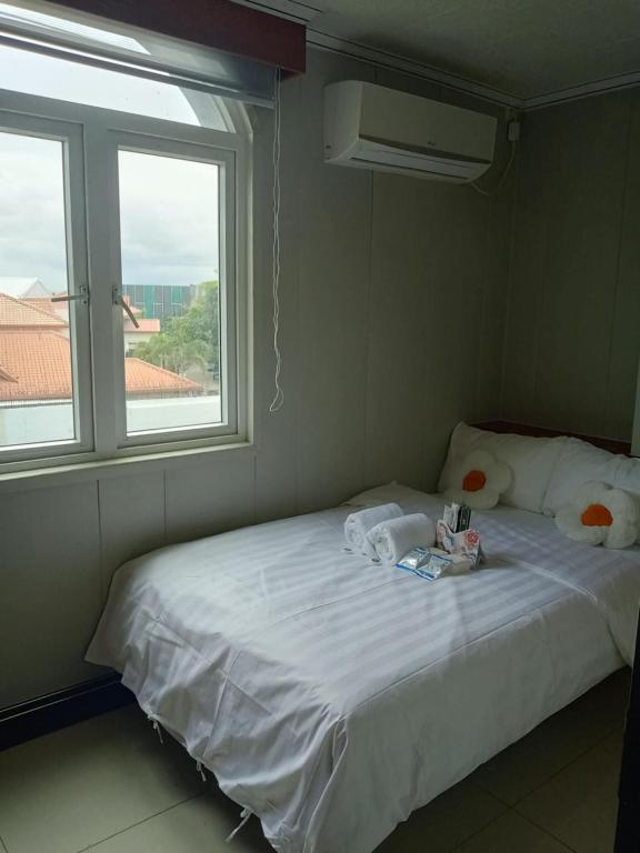 Postel nebo postele na pokoji v ubytování Baoly Clark Residences
