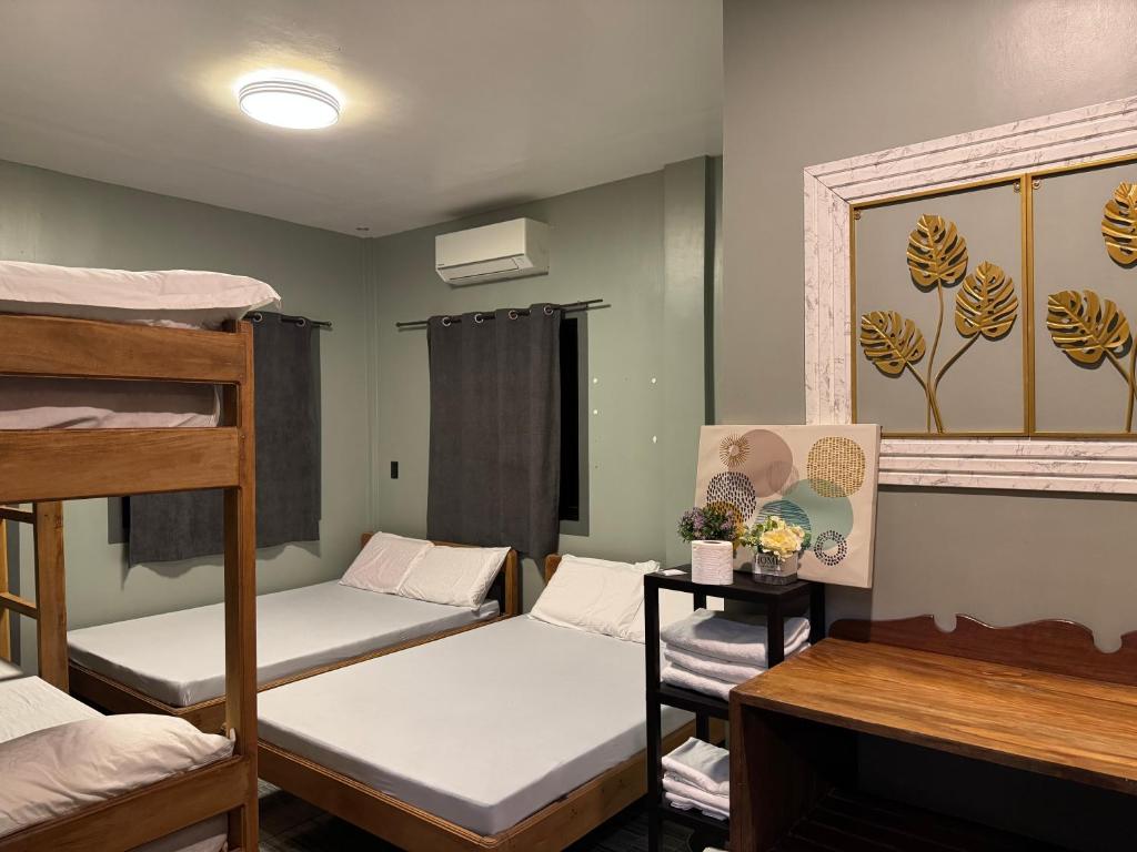 Postel nebo postele na pokoji v ubytování Uno Dus Tourist Inn
