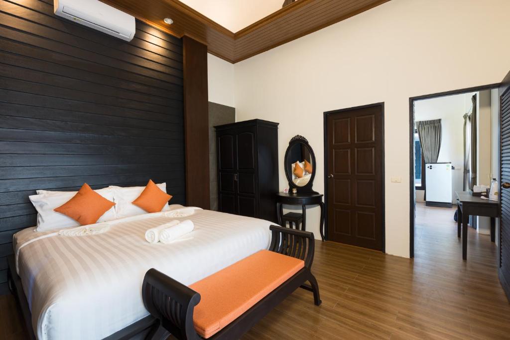 Postel nebo postele na pokoji v ubytování Blue Palm Residence Kata