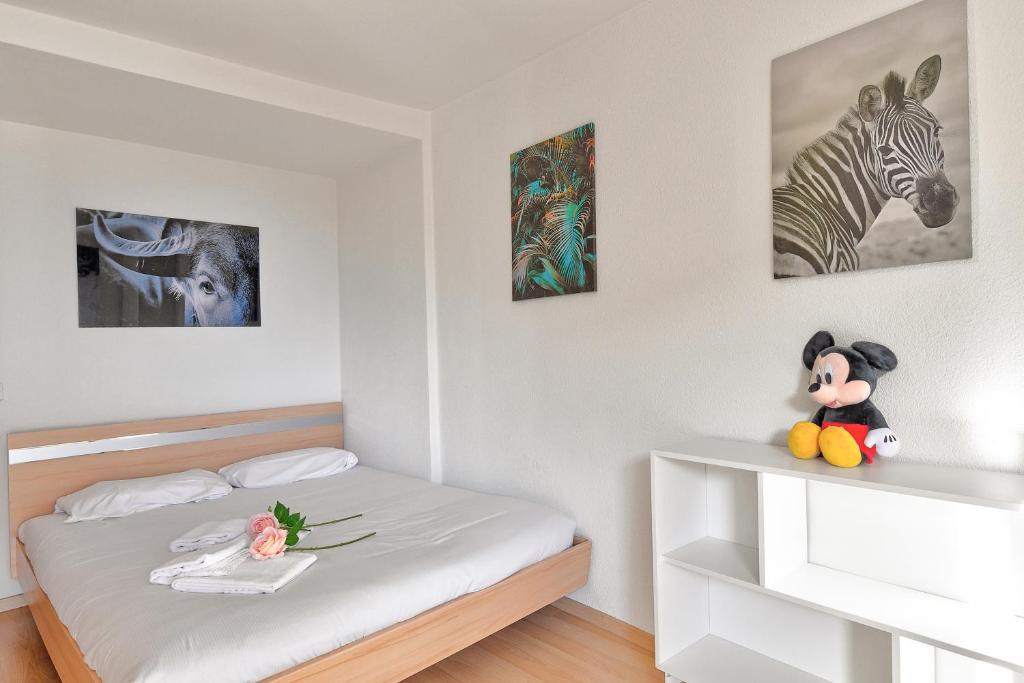 Postel nebo postele na pokoji v ubytování Lugano Bay View
