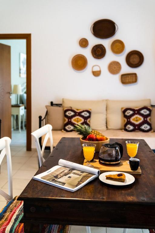 a table with plates of food on top of it at Coastal Key 3 in Gázion