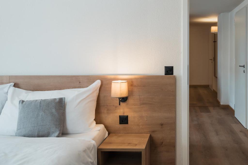 Postel nebo postele na pokoji v ubytování Hotel Brocco & Posta