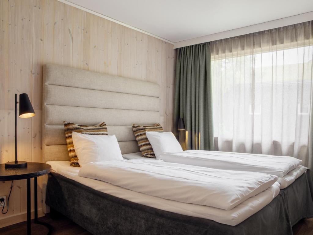 Postel nebo postele na pokoji v ubytování Ice Hotel